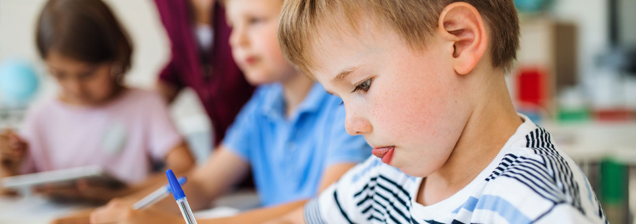 Elementary kids in the classroom working on assignments