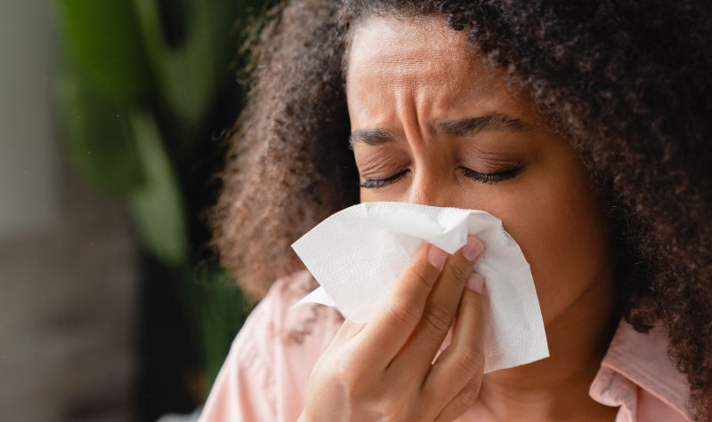 Sick woman with a tissue
