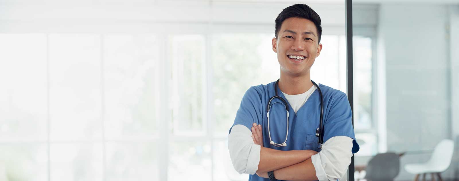 Medical assistant looking at camera smiling