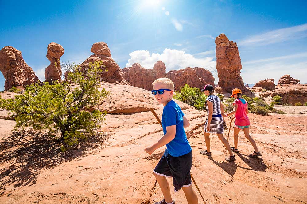 Boy and family hiking in southern Utah